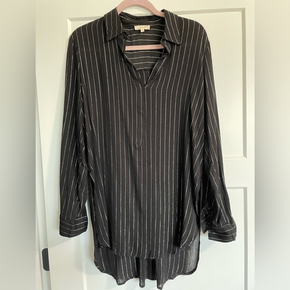 Long sleeve black and silver long sleeve top.  Longer back with a hip split.